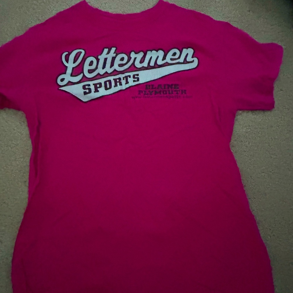 Pink letterman’s shirt